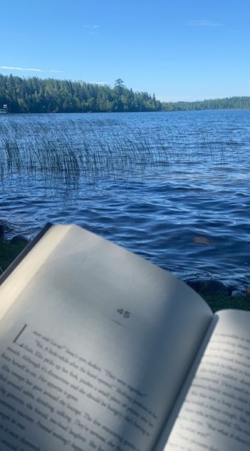 Book Club reading by lake cropped