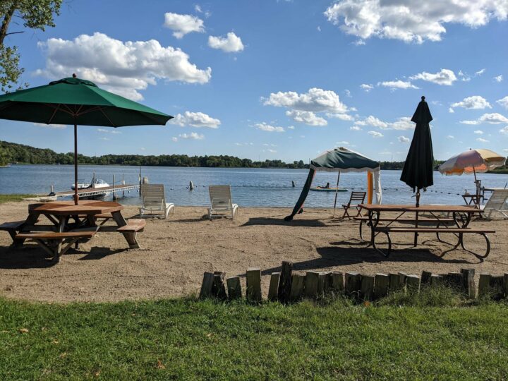 Swan Lake Resort & Campground - sandy beach chairs & umbrellas